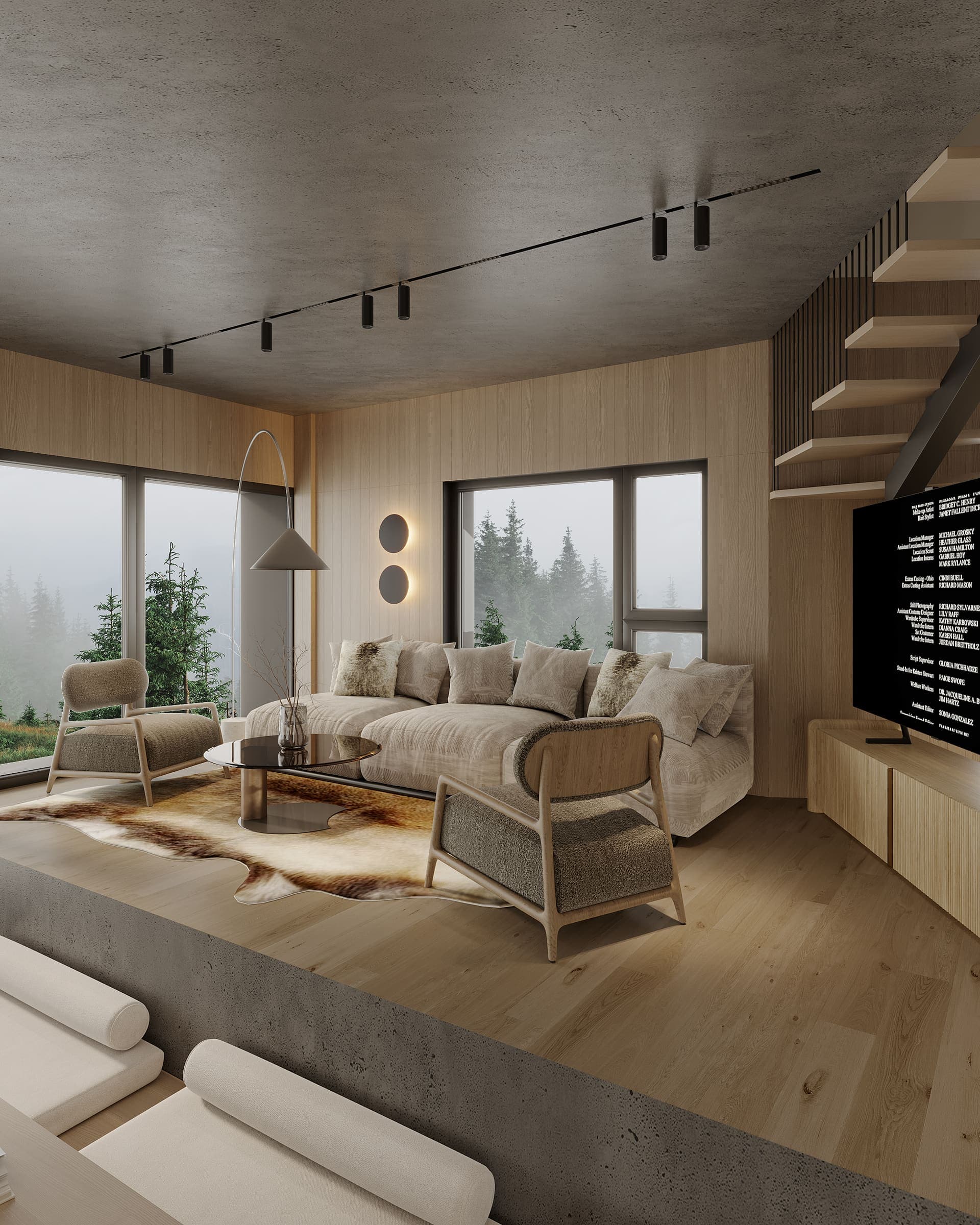 Living room with woven armchairs and a window onto the pine forest