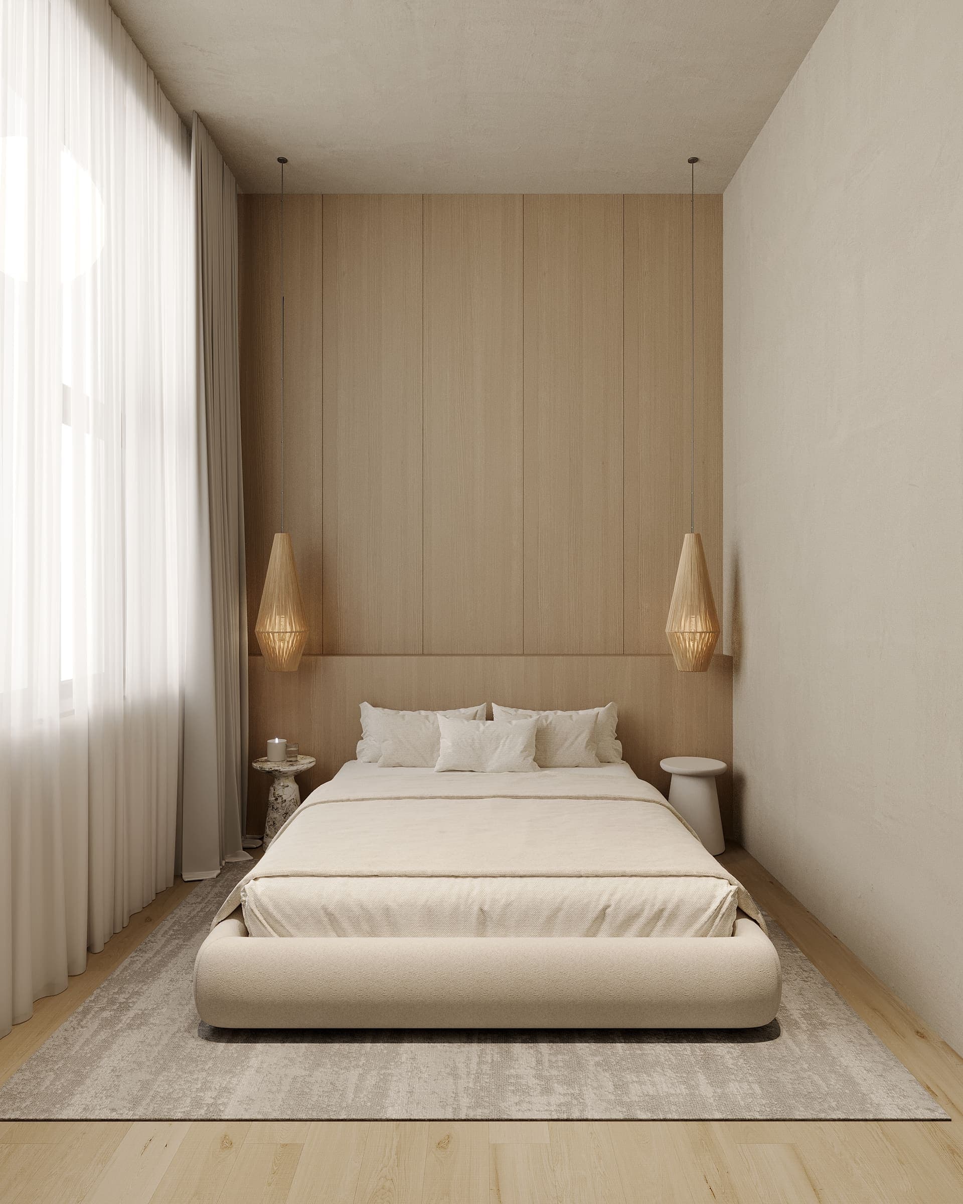 Bedroom with a rounded upholstered bed and rattan pendant lamps